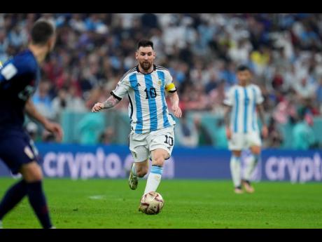 Credit: AP Argentina’s Lionel Messi controls the ball during the World Cup semifinal match between Argentina and Croatia at the Lusail Stadium in Qatar on Tuesday.