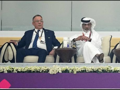 Moroccan FA President Fouzi Lekjaa (left) sits in the tribune for the World Cup semifinal  match between France and Morocco at the Al Bayt Stadium in Al Khor, Qatar on Wednesday, December 14.