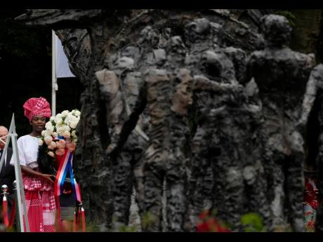 
Wreath laying at the National Slavery Monument after Amsterdam Mayor Femke Halsema apologised for the involvement of the city’s rulers in the slave trade during a nationally televised annual ceremony in Amsterdam, Netherlands, July 1, 2021. 