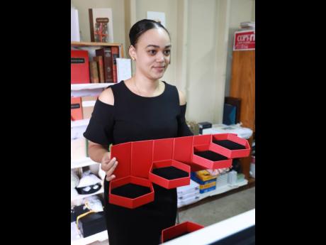 JAD Executive Director, Kimberly Sherlock shows off one of the latest products that the bindery