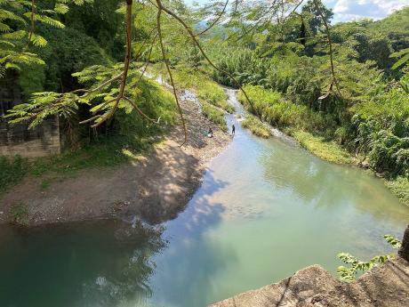 Credit: Photo by Ainsworth Morris An aerial view of the section of the Thomas River in Chapelton, Clarendon, where both Brihania Sindale and Remo Douglas drowned on Friday.