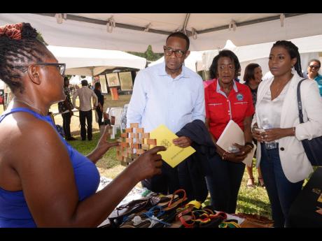 David Dobson, chief technical director in the Ministry of Tourism; Sheryll Lewis (second right), craft coordinator, Tourism Product Development Company (TPDCo); and Karla Mullings (right), business development manager at the Jamaica Cultural Development Co