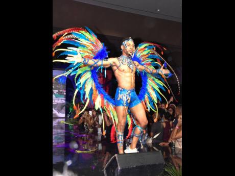 David Dewer’s Luminous Lagoon not only has female options reflective of Jamaica’s glistening waters. It also put the men in feathers and centrestage. 