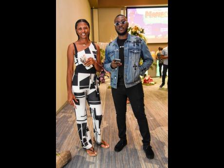 Credit: Nicholas Nunes/Photographer Jacqueline James (left) and Akeem Lattibeaudiere were in the house to take in the art.