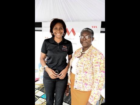 CEO of the VM Foundation, Samantha Charles, shares the lens with Jean Duhaney, acting team lead of the St. Catherine Office of the Child Protection and Family Services Agency at the recently held VM Foundation Financial Wellness and Parenting Expo.