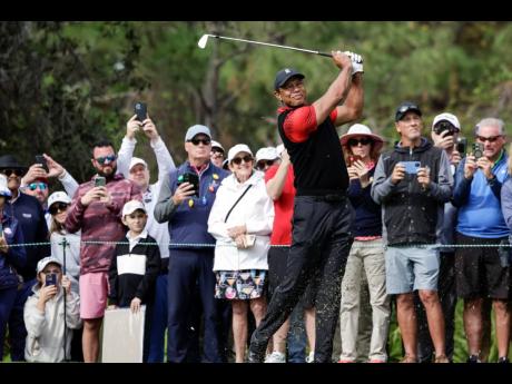 
Tiger Woods tees off on the 4th hole during the final round of the PNC Championship golf tournament last Sunday in Orlando, Florida.