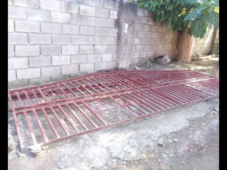 Credit: Photo by Hopeton Bucknor The gate which fell on Liam Williams at the family home in Savanna-la-Mar, Westmoreland, on Wednesday morning.