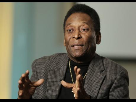 In this April 2, 2014 file photo, Pelé gestures during an interview  at The Associated Press in New York.