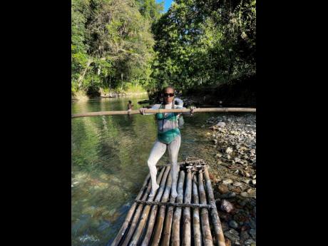 Covered in bentonite clay, Rich-Jones enjoys a day of rafting.