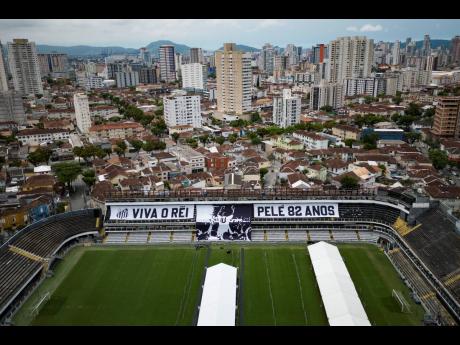 Giant banners that read in Portuguese ‘Long live King Pelé, 82 years’, are displayed in the stands of the Vila Belmiro stadium, home of the Santos soccer club, where Pelé’s funeral will take place, in Santos, Brazil.  Pelé, who played most of his 