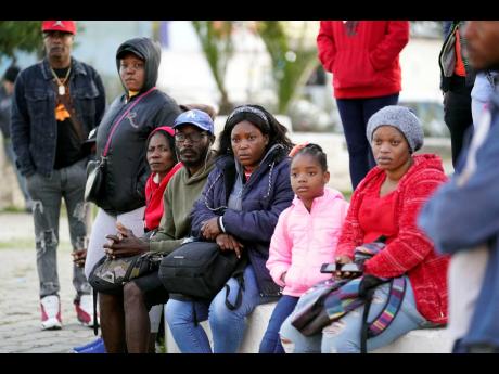 Haitian migrants listen to immigration attorneys giving updates on their current asylum status on December 20, 2022, in Tijuana, Mexico. 