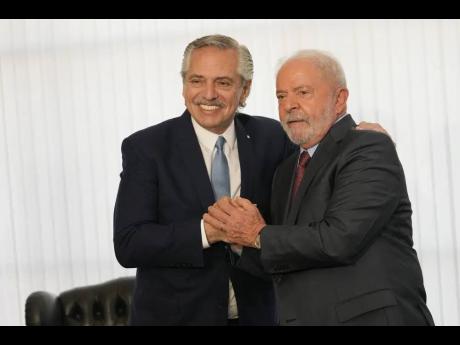 Brazilian President Luiz Inacio Lula da Silva (right) and Argentina’s President Alberto Fernandez pose for photos during a bilateral meeting at Itamaraty Palace, the day after Lula’s inauguration in Brasilia, Brazil, on Monday.