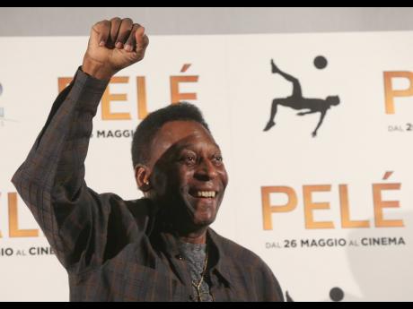 Brazilian football legend Pele gestures during a photocall of the movie ‘Pele’ in Milan, Italy, in May 2016. 