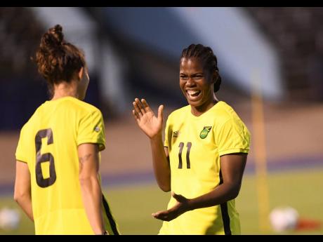 Credit: Ricardo Makyn From left: Reggae Girlz midfielder Havana Solaun with team captain Khadija Shaw.