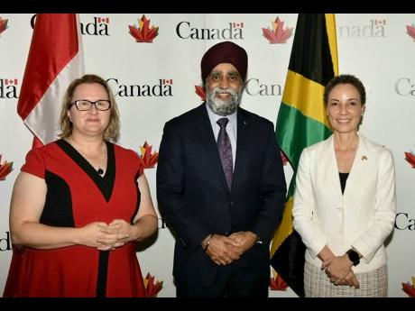 From left: Canadian High Commissioner to Jamaica Emina Tudakovic, Canada’s Minister of International Development Harjit S. Sajjan and Minister of Foreign Affairs and Foreign Trade Senator Kamina Johnson Smith pose for an official photo.