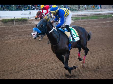 I’VE GOT MAGIC, ridden by Tevin Foster, wins the St Catherine Cup over six furlongs, a three- year-old and upwards open allowance stakes at Caymanas Park yesterday.