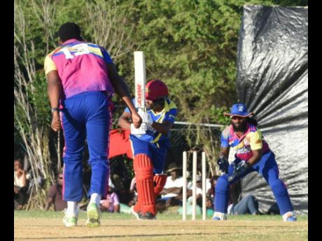 Brian Lara is bowled off a no ball from Damion Ebanks during the Resi Legends Cricket Festival at the Treasure Beach Sports Complex today.