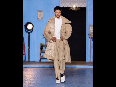 Model Mathias wearing a Bianca Saunders cut top, esso trouser and cut out puffer.