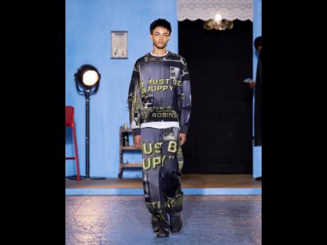 “Must be a duppy,” are the famous words from Oliver Samuels in ‘Oliver at Large’. These words are now emblazoned on this Bianca Saunders track suit for all to wear.