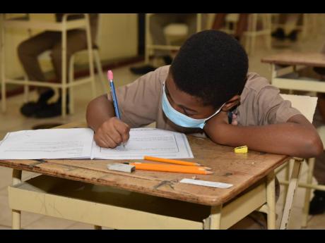 In this June 2022 photo, a student is seen writing the PEP exam.