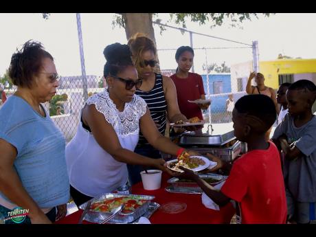 Members of Angel Network Partners man the food station during the Torrington Park initiative.