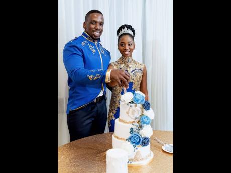 The husband and wife duo engaged in the traditional cutting of the wedding cake.
