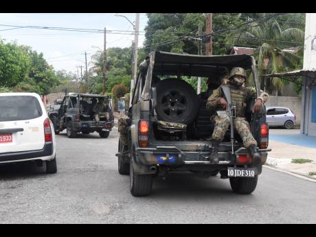 Jamaica Defence Force soldiers on patrol in Franklyn Town, St Andrew. 