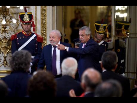 AP
Brazilian President Luiz Inacio Lula da Silva, second left, and Argentina’s President Alberto Fernandez arrive to give a joint statement at the government house in Buenos Aires, Argentina, on Monday, January 23. 