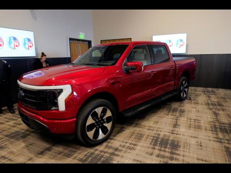 The Ford F-150 Lightning is displayed at the M1 Concourse car club.