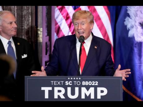 Credit: AP Former President Donald Trump speaks at a campaign event at the South Carolina Statehouse. South Carolina Governor Henry McMaster listens at left.
