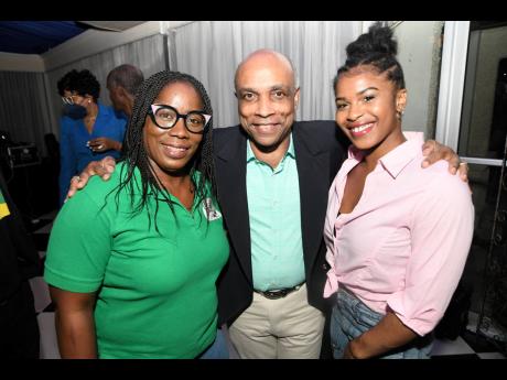 Christopher Samuda (centre) President of the Jamaica Olympic Association poses with Tyesha Mattis (right) gymnast and Nicole Grant, President of the Jamaica Gymnastic Association.