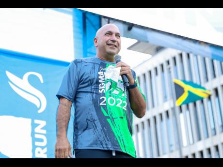 Credit: Contributed Christopher Zacca, president and CEO, Sagicor Group Jamaica addressing the participants at the 2022 Sigma Corporate Run event. The event was significantly scaled down with less than 5000 people participating in total over a two weekends.