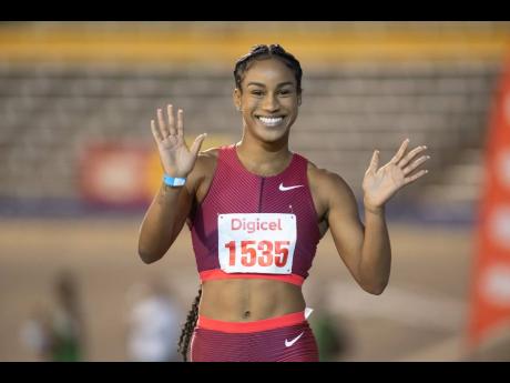 
Briana Williams celebrates her win in the women’s 60 metres at the Camperdown Classics held inside the National Stadium yesterday.