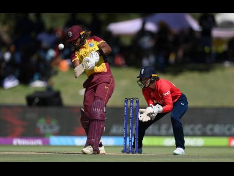 
Hayley Matthews of West Indies plays a shot as Amy Jones of England keeps during the ICC Women’s T20 World Cup group B match between the teams at Boland Park yesterday in Paarl, South Africa.