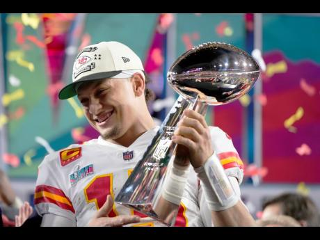 Kansas City Chiefs quarterback Patrick Mahomes  holds the trophy after their win against the Philadelphia Eagles in the NFL Super Bowl 57 football game, Sunday, February 12, 2023, in Glendale, Arizona. The Kansas City Chiefs defeated the Philadelphia Eagle