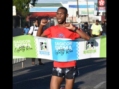 Credit: Ian Allen Ian Allen
Garfield Gordon winning the Sagicor Sigma 25th Legacy run in New Kingston yesterday.