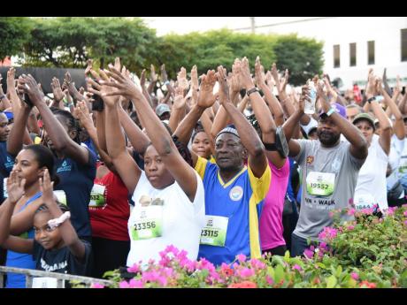 Credit: Ian Allen Some of the more than 21,000 particpants who took to the streets of New Kingston yesterday morning for the Sagicor/Sigma Corporate Run.