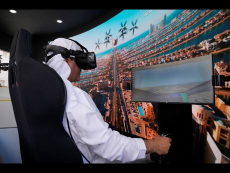 A man experiences a driving simulator of a flying taxi at the Dubai Roads and Transportation Authority’s stand during the World Government Summit in Dubai, United Arab Emirates, on Monday, February 13, 2023.