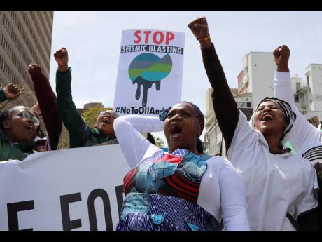 Environmental activists take part in a protest calling for the government to take immediate action against climate change in Cape Town, South Africa, on September 24, 2022, ahead of COP27, which was held in Egypt last November. 