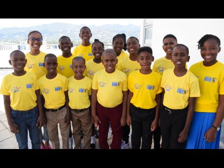 The 14 finalists in the Gleaner’s Children’s Own Spelling Bee National Competition 2023 pose for a photo at The Jamaica Pegasus hotel: (front row, from left) Nathan Bailey, St Catherine; Nicardo Henry, Kingston; Dayton Jennings, Portland; Khalil James,