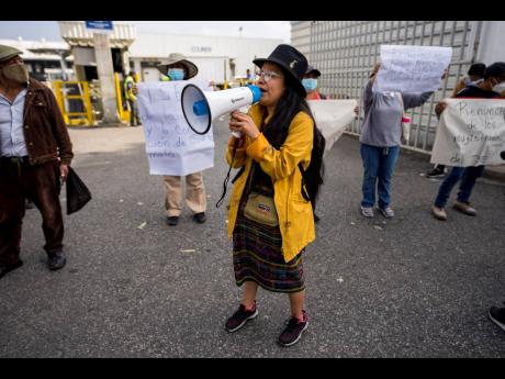 Supporters of the Liberation of the People (MLP) political party protest that the Supreme Electoral Tribunal denied the candidacy of their vice-president hopeful, Jordan Rodas, in Guatemala City.
