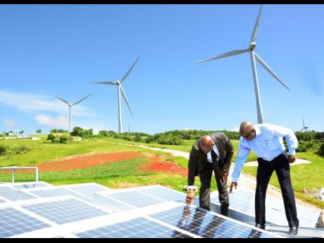 Wind and solar equipment at the Wigton Windfarm in central Jamaica.