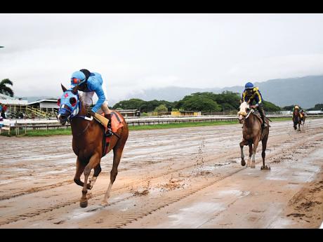 
RUNAWAY ALGO, ridden by Christopher Mamdeen, wins the $1,140,000 Bridge 99FM Cup event, ahead of ONEOFAKIND with Reyan Lewis, which was for three-year-old and upwards open allowance at Caymanas Park last year.
