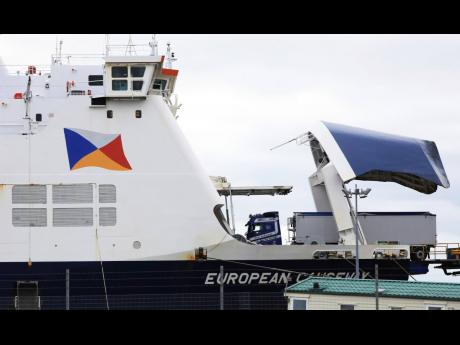 AP 
Freight lorries board the P&O ferry from Larne to Cairnryan at Larne Port, Northern Ireland, on Monday, February 27, 2023. The UK and European Union ended years of wrangling and sealed a deal to resolve their thorny post-Brexit trade dispute over North