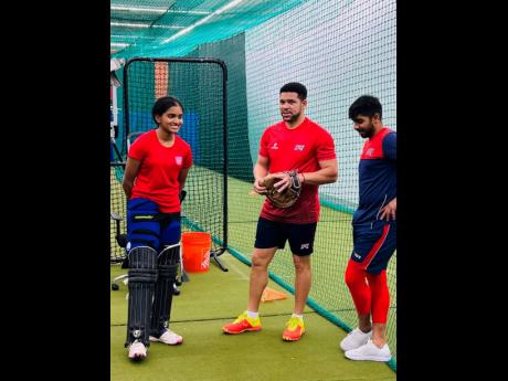 Credit: Lennox Aldred Former Jamaica and West Indies batsman Ricardo Powell (centre) with Jessica Willathgamuwa (left) and Sagar Patel at the Ricardo Powell Cricket Academy in Peachtree, Georgia.