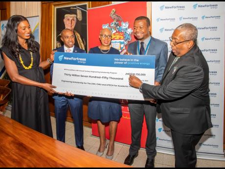 New Fortress Energy (NFE) Foundation hands over the symbolic $31-million cheque for tertiary scholarships for 68 engineering/STEM students studying at The University of the West Indies, Mona (UWI), University of Technology, Jamaica (UTech) and Caribbean Ma