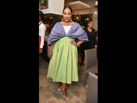 Caribbean Airlines cabin crew Instructor, Island Child organiser and Principal of BrandEd Norma Williams never dissapoints, and at the premiere of Buzo Osteria Italiana she stood out in one of her designs.
