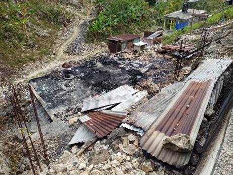 Credit: Hopeton Bucknor The burnt-out house in Berkshire community, Westmoreland where the charred remains of Keisha Walters and her son Joel were found.