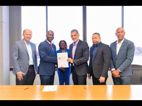Credit: Contributed Kingston Wharves CEO Mark Williams (second left), and Director of Terminal Operations Valrie Campbell were on hand for the signing of the agreement in Werf de Wilde. Present from the Curaçao Port Authority were Managing Director Humberto de Castro; Chief