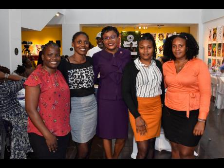 From left: Sashana Benjamin; Kesima Richards; Khayon Desouza-White, senior manager, retail effectiveness, Scotiabank; Martesha Allen and Mariephil Ridguard at the Scotiabank /Project STAR Women’s Day Reception, held at the National Gallery in downtown Ki